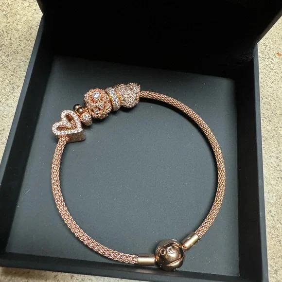 Authentic rose Pandora bracelet and beads